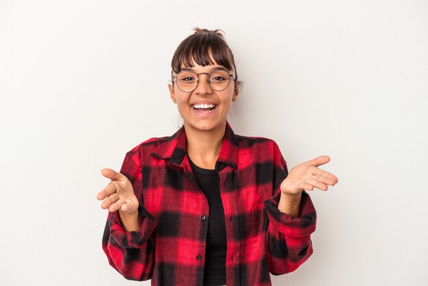 Young mixed race woman isolated on white background  feels confident giving a hug to the camera.