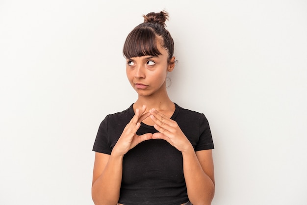 Young mixed race woman isolated on white background  making up plan in mind, setting up an idea.