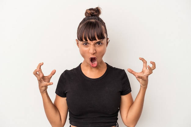 Photo young mixed race woman isolated on white background  screaming with rage.