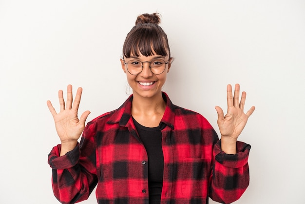Young mixed race woman isolated on white background  showing number ten with hands.