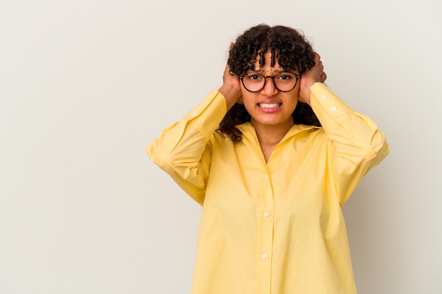 Young mixed race woman isolated on white background touching back of head, thinking and making a choice.