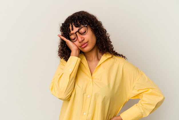 Young mixed race woman isolated on white background who is bored, fatigued and need a relax day.