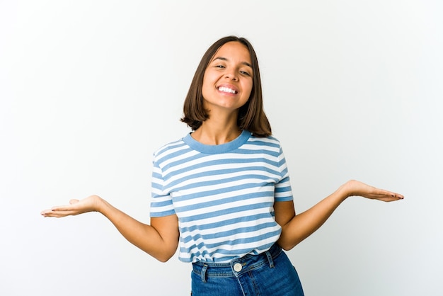 Young mixed race woman showing a welcome expression.