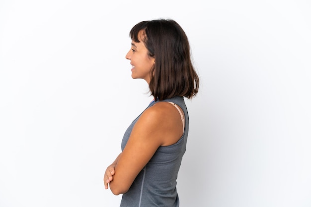 Young mixed race woman with medals isolated on white background in lateral position