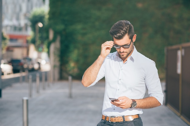 Young modern businessman posing