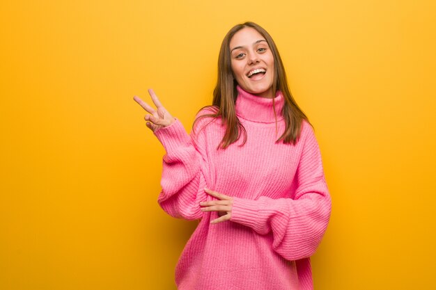 Young modern woman doing a gesture of victory