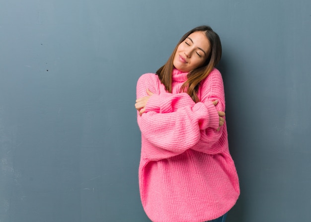 Young modern woman giving a hug