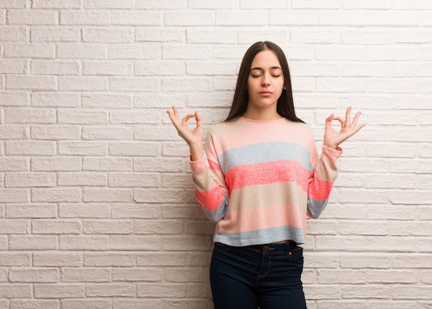 Young modern woman performing yoga