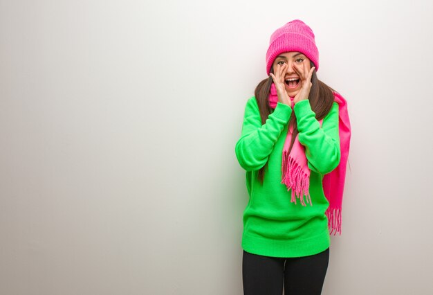 Young modern woman shouting something happy to the front