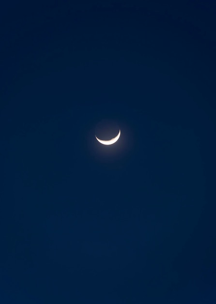 A young moon in the night sky in Greece