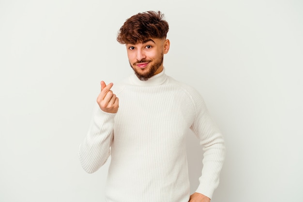 Young Moroccan man isolated on white showing that she has no money.