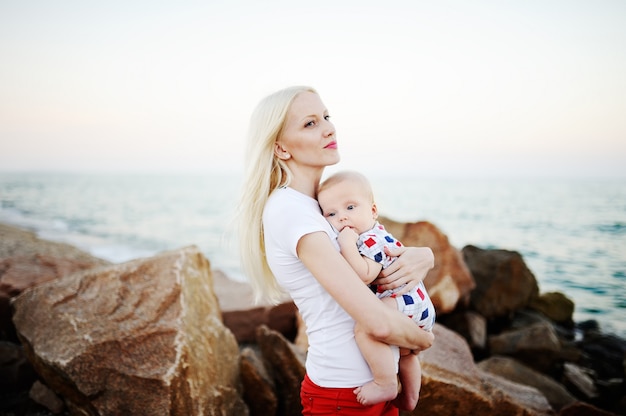 Young mother carrying a child