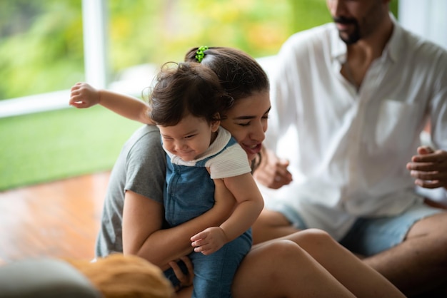 Young mother and child baby are happy at home childhood family concept with caucasian mom and little boy newborn care lifestyle