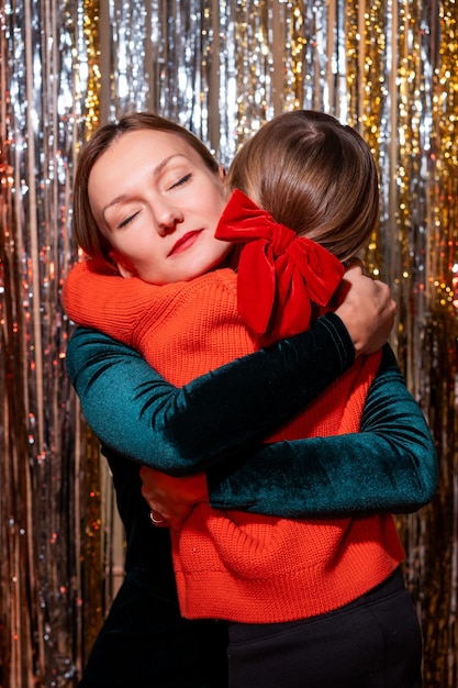 Young mother and daughter preparing for home party