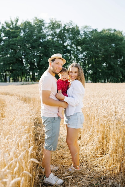 A young mother father and little son enjoy nature together in the fresh air A happy family