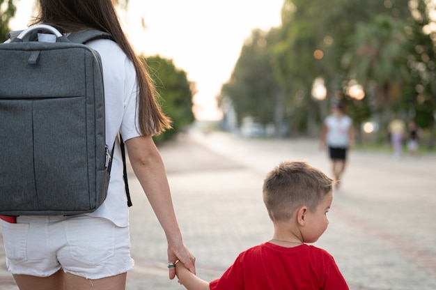 A young mother goes on tourism with her child.