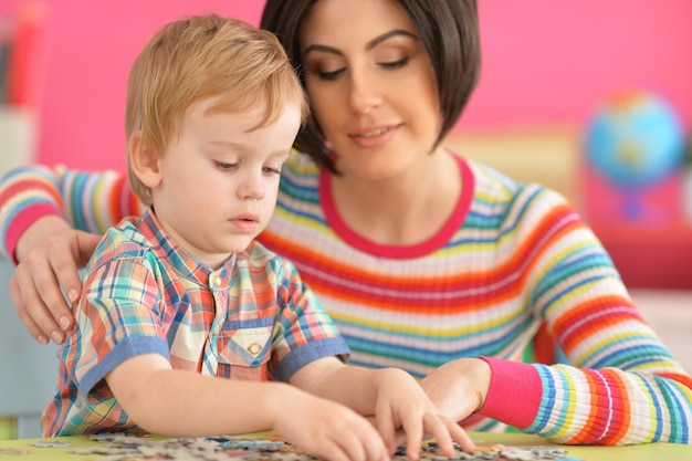 Young mother playing with son