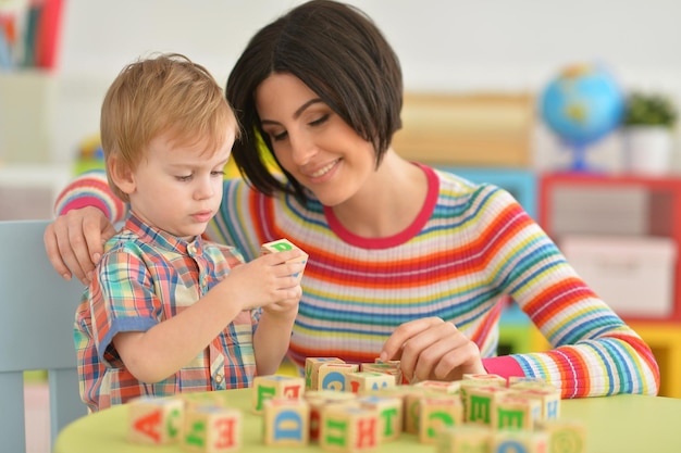 Young mother playing with son