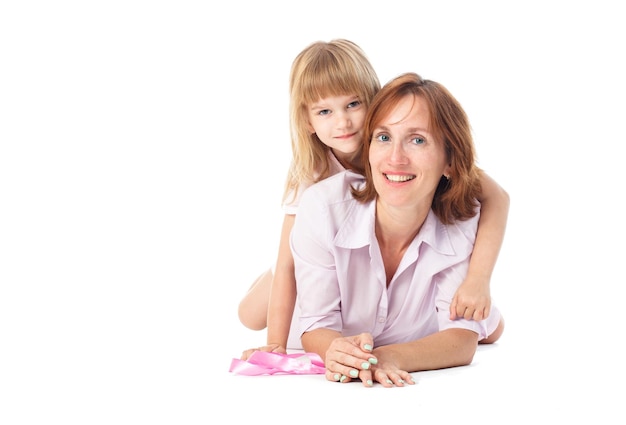 Young mother with children on white happy smiling family inside