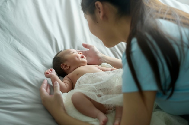 Young mother with a Cute new born baby