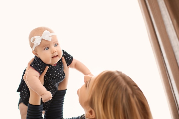 Young mother with her baby at home