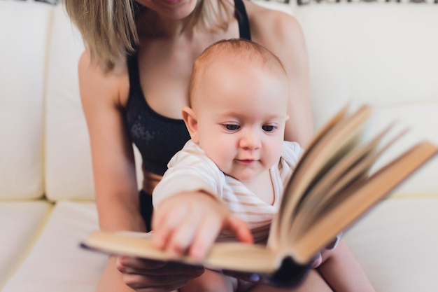 young mother with her baby over white
