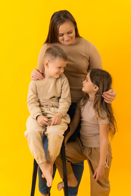 A young mother with her children looking at each other