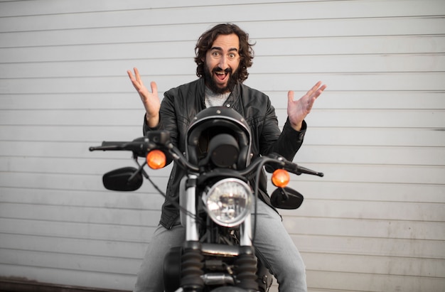 Young motorcycle rider on his vintage bike