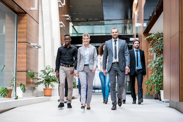 young multi ethnic business people group walking standing and top view