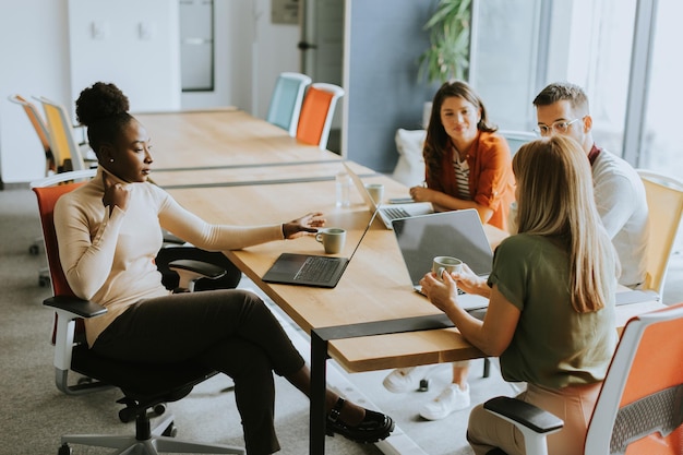 Young multiethnic startup team working at the modern office