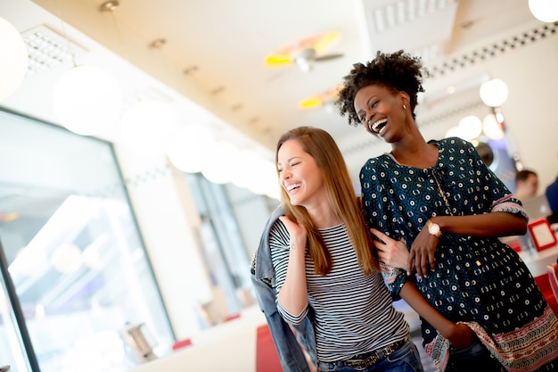 Young multiethnic women in the diner