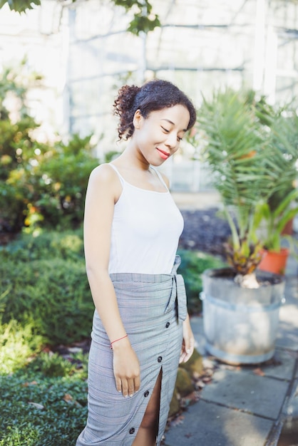 Young multiracial African American woman in park summer