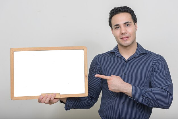 young muscular handsome businessman on white