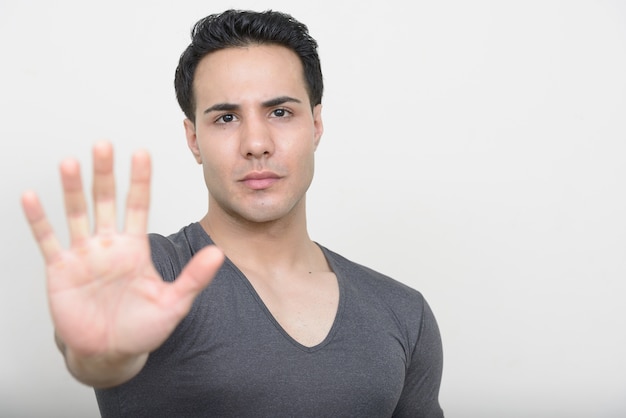 young muscular handsome man on white