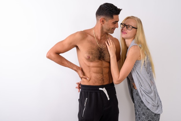 Young muscular Persian man and beautiful blond woman together
