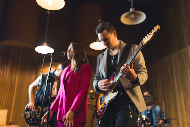 Young musicians practising the song in rehearsal room