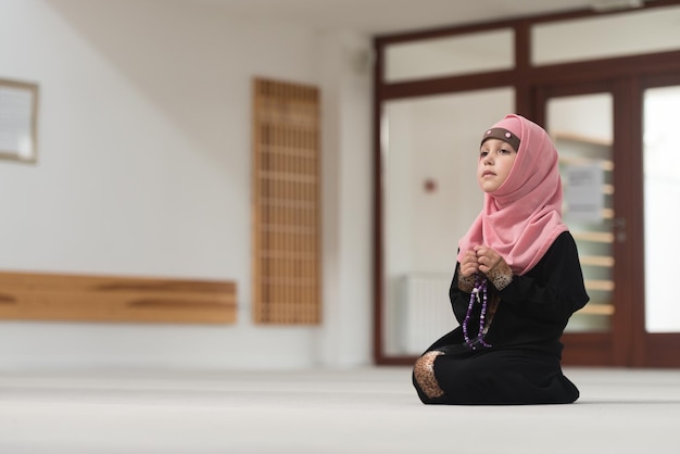 Young Muslim Girl Is Holding In Hand Rosary