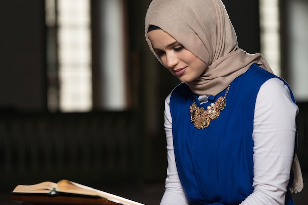 Young Muslim Girl Reading The Koran