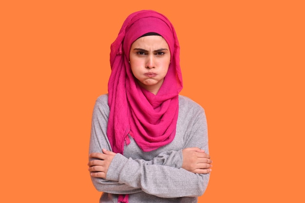 young muslim girl wearing hijab smiling and pleasant phone conversation indian pakistani model