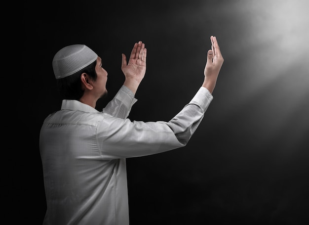 Young muslim man praying