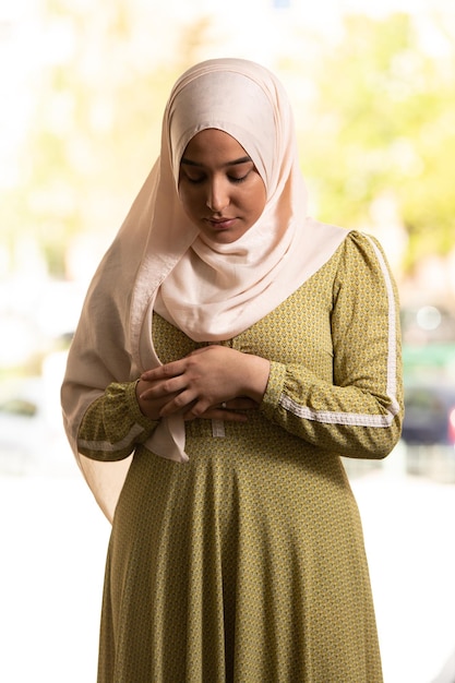 Young Muslim Woman is Praying in the Mosque