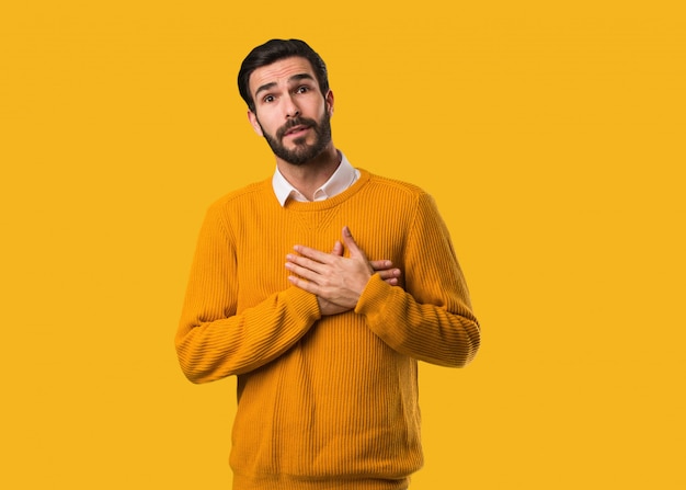 Young natural man doing a romantic gesture