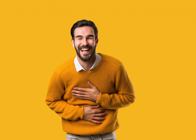 Young natural man laughing and having fun