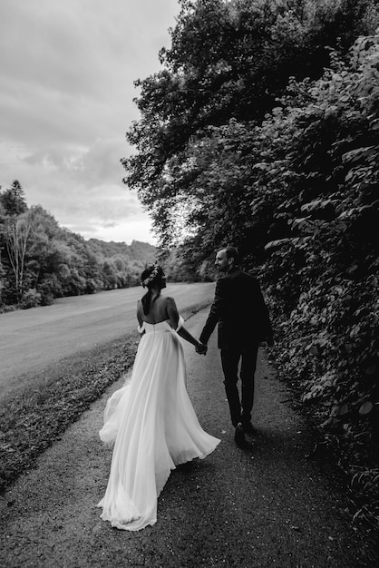 Young newlyweds black and white people from behind bride and groom