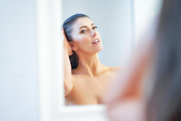 Young nice brunette woman in the bathroom High quality photo