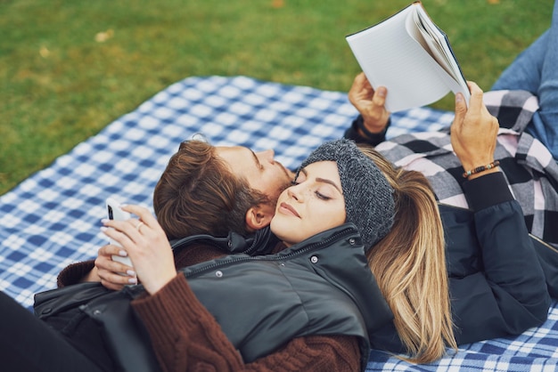 Young nice couple having fun on camping. High quality photo