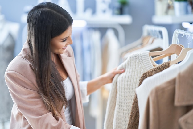 Young nice girl in store during shopping. High quality photo