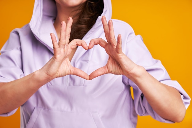 Young nice woman isolated over yellow background high quality photo