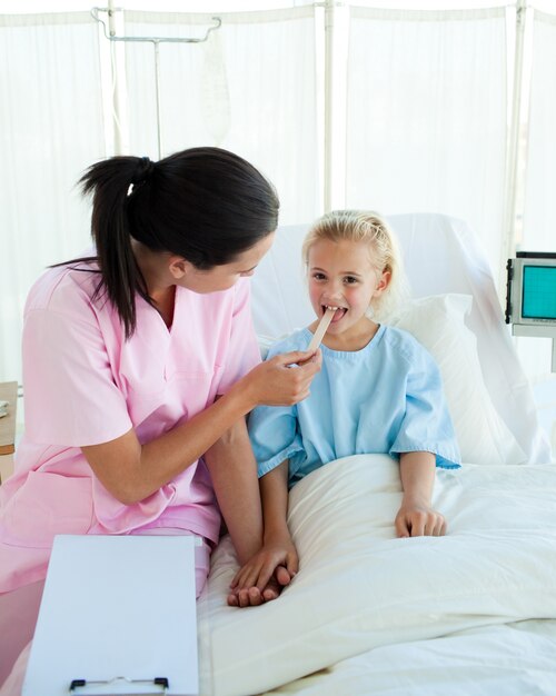 Young nurse attending a child patient 