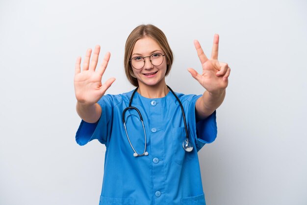 Young nurse doctor woman isolated on white background counting eight with fingers